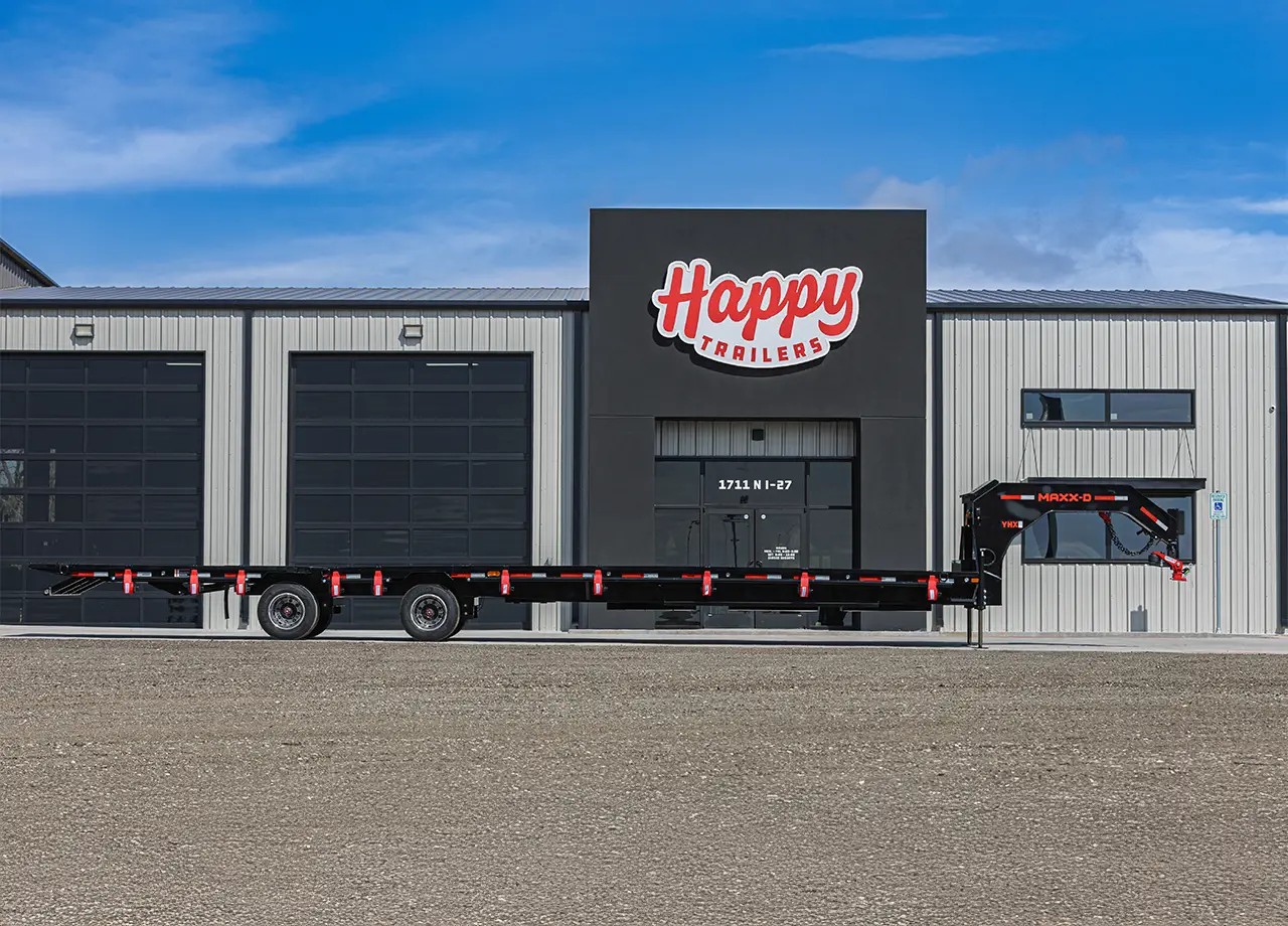 Happy Trailers Dealership Lubbock Texas MAXX-D Gooseneck Flatbed In Front